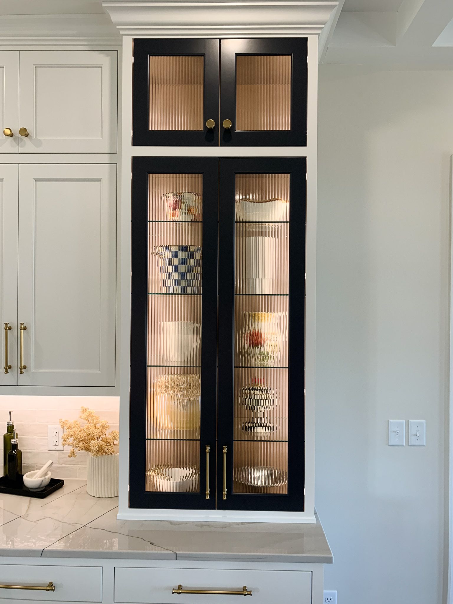 Cabinet with cups and bowls set in it.