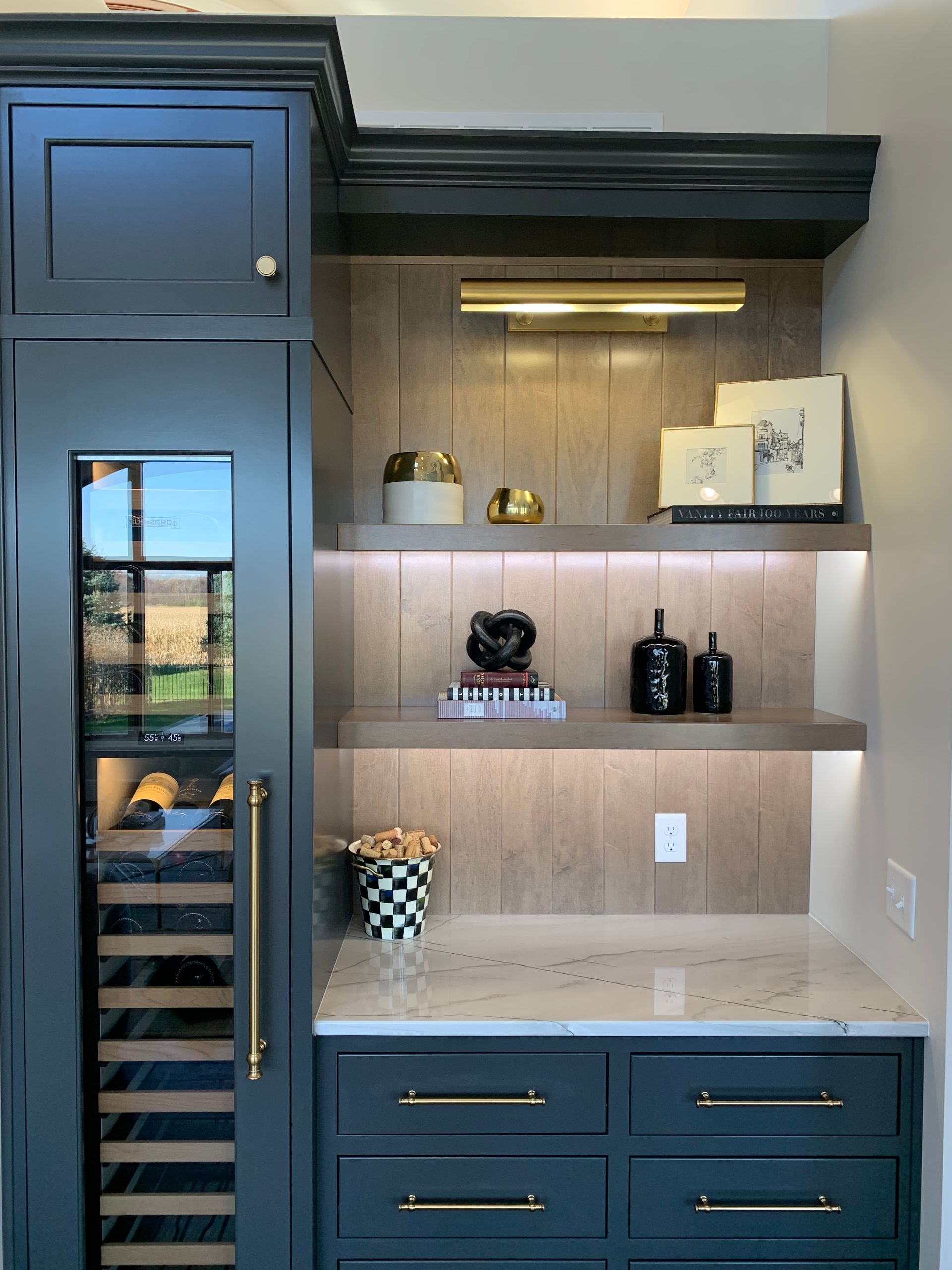 A wine bar with a blue cabinet for storing wine.