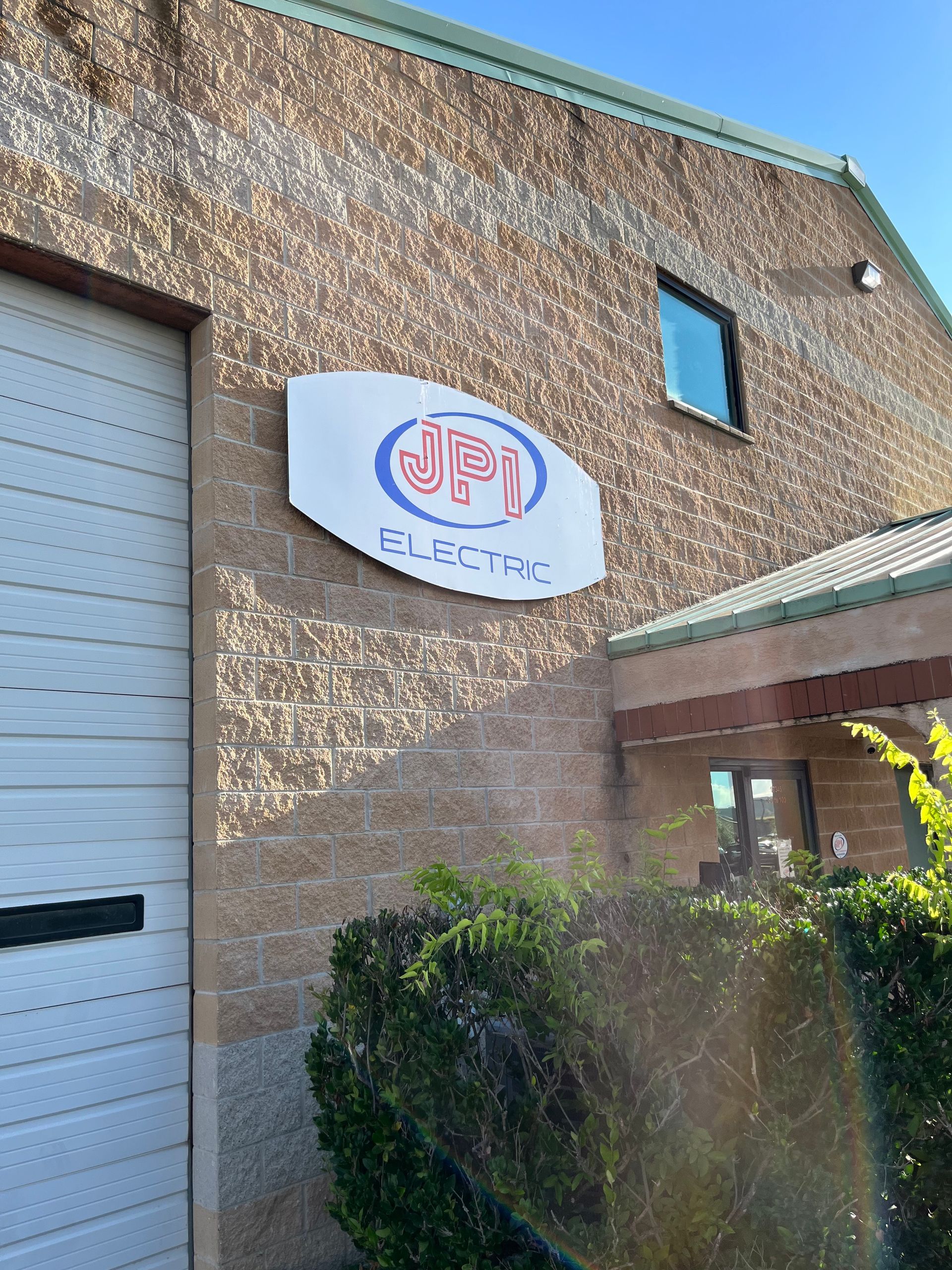 a building with a sign that says jpi on it