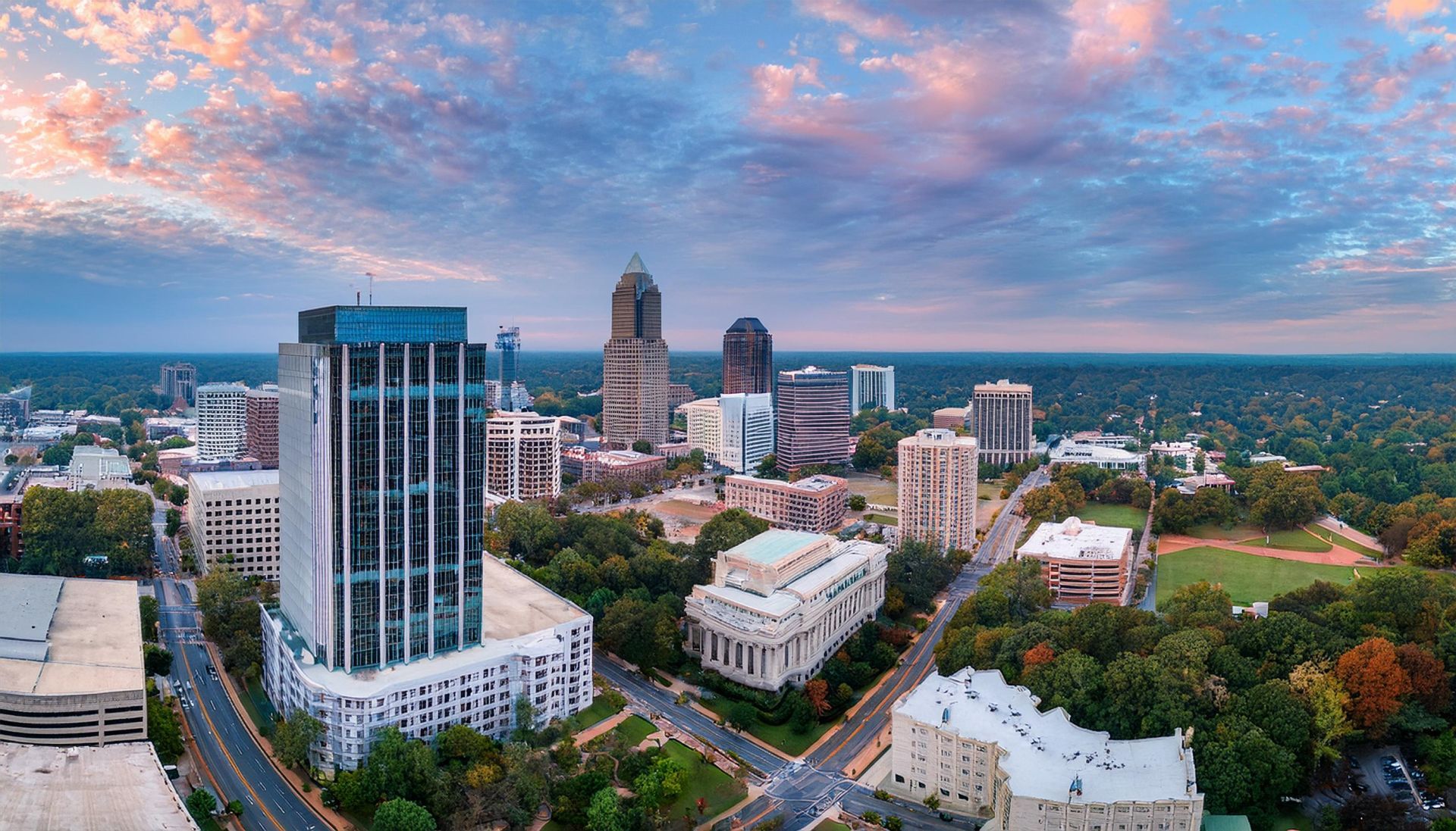 An aerial view of a city with a lot of buildings and trees.