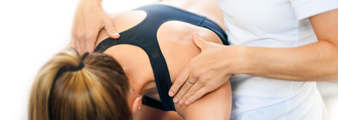 Physical Therapist Massaging Lower Back — Hastings, NE — Adams County Chiropractic