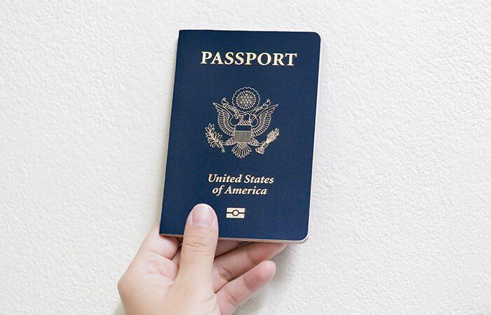 Hand holding a US passport