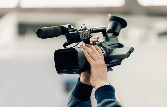 Hand holding a video camera