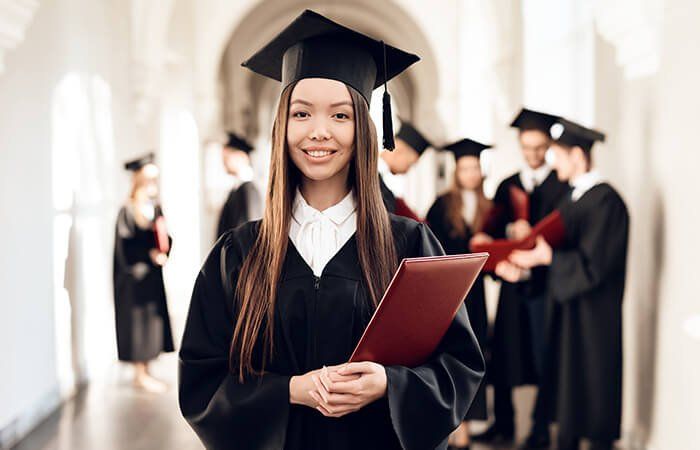 Graduate girl holding a diploma