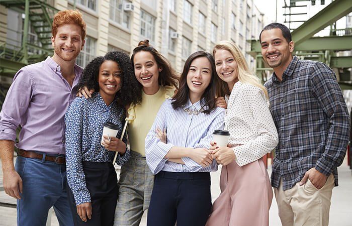 A group of young people smiling