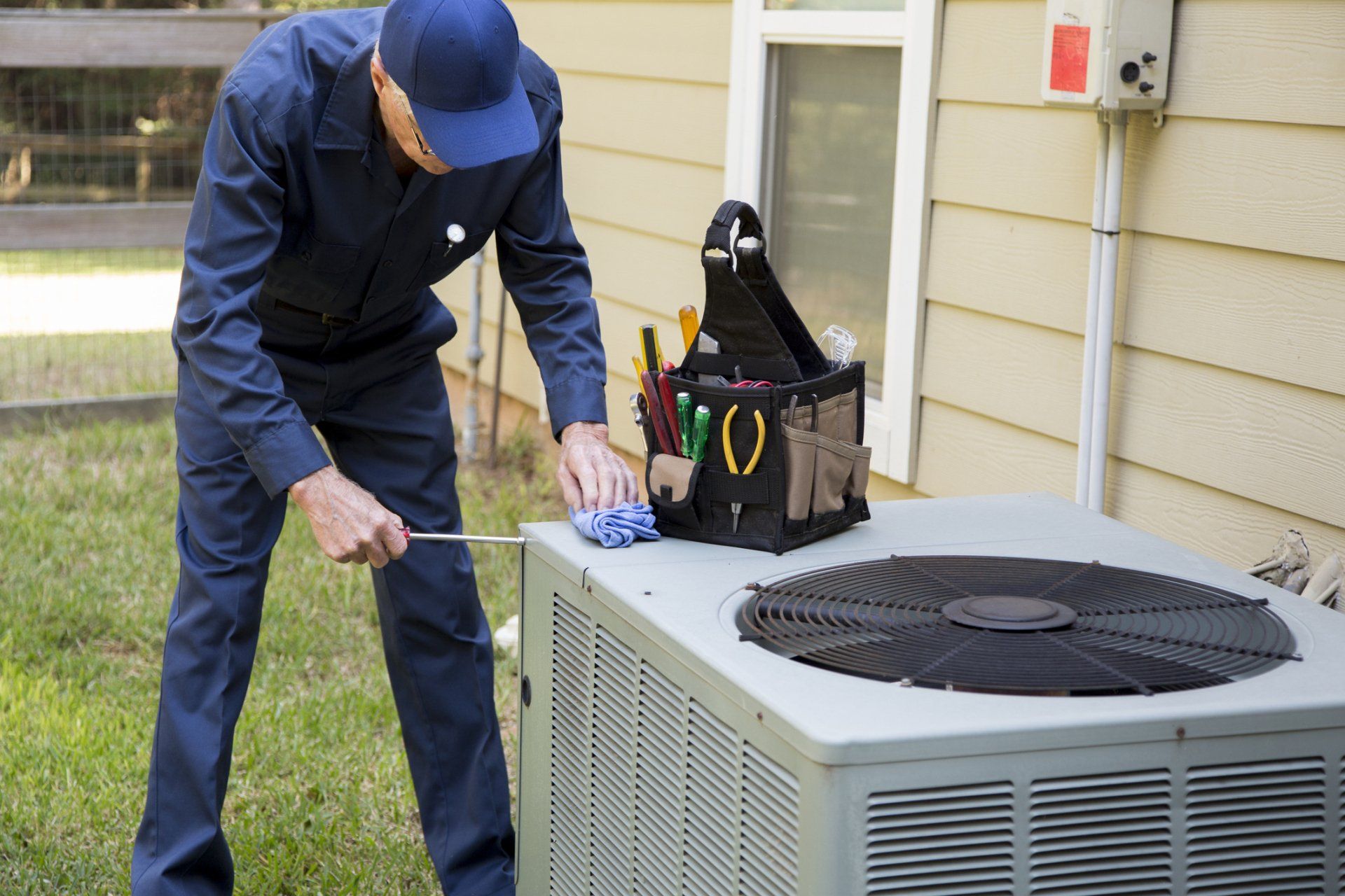 Technician Repairing Air Condition - Syracuse, NY - Gomez Comfort Systems