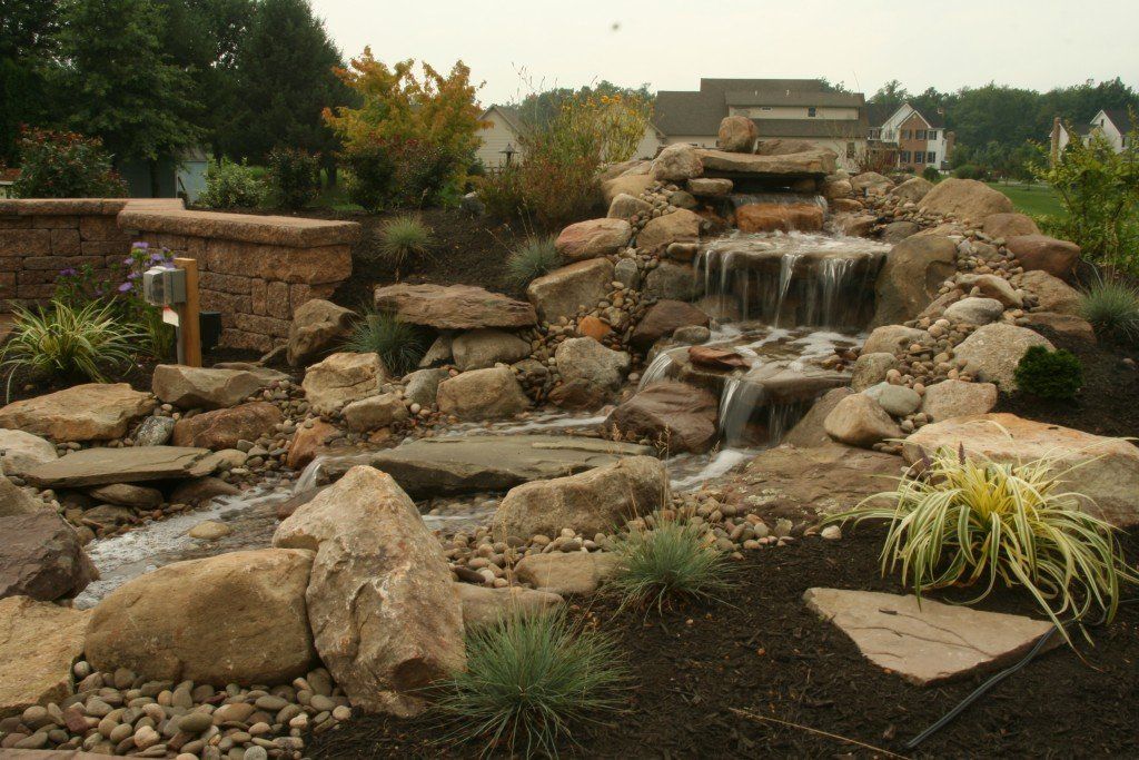 Pond with brown rock — custom water feature in Newville, PA