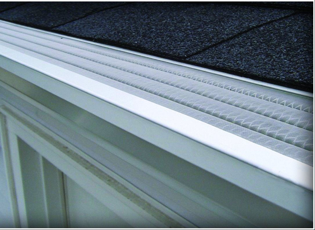 Worker Fixing Roof — Baton Rouge, LA — Pioneer Gutters