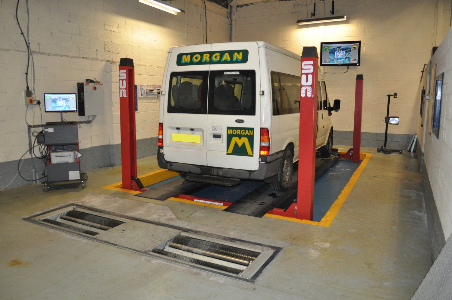 MOT bay with van parked at Tomlinson Autos Ltd