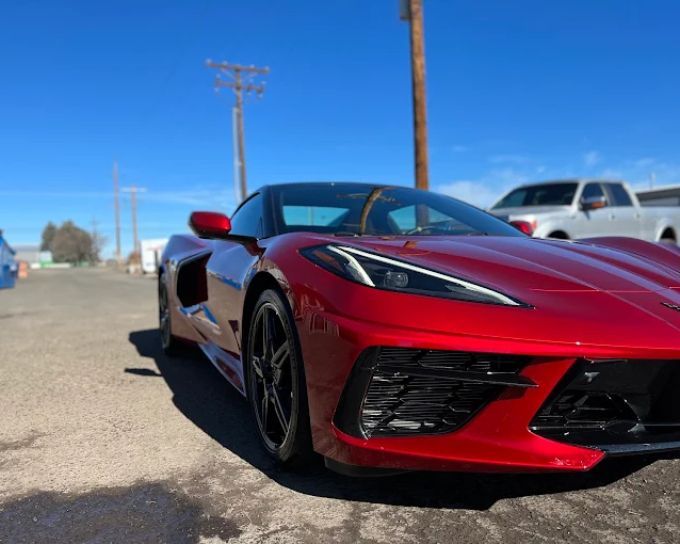 Red Chevrolet Corvette with PPF paint protection film, detailed at Perfection Plus Auto Salon