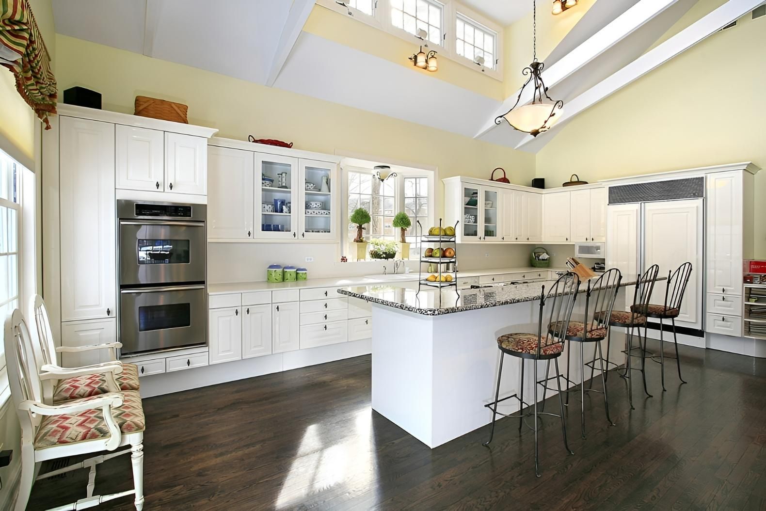 A Kitchen With White Cabinets and Stainless Steel Appliances — Precision Kitchens & Cabinets in Lennox Head, NSW