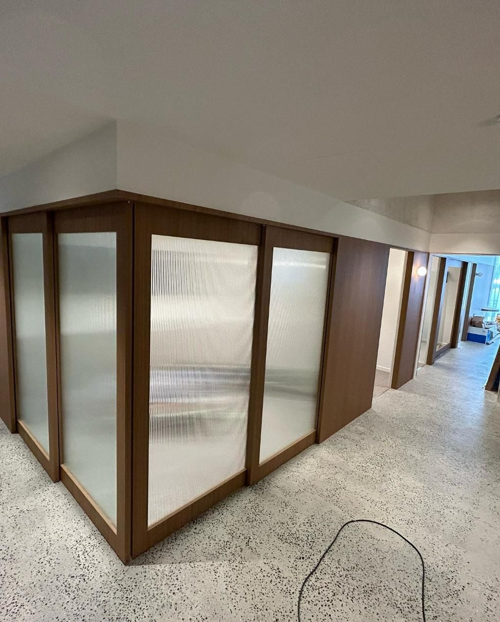 A Room With a Lot of Windows and a Marble Floor — Precision Kitchens & Cabinets in Ballina, NSW