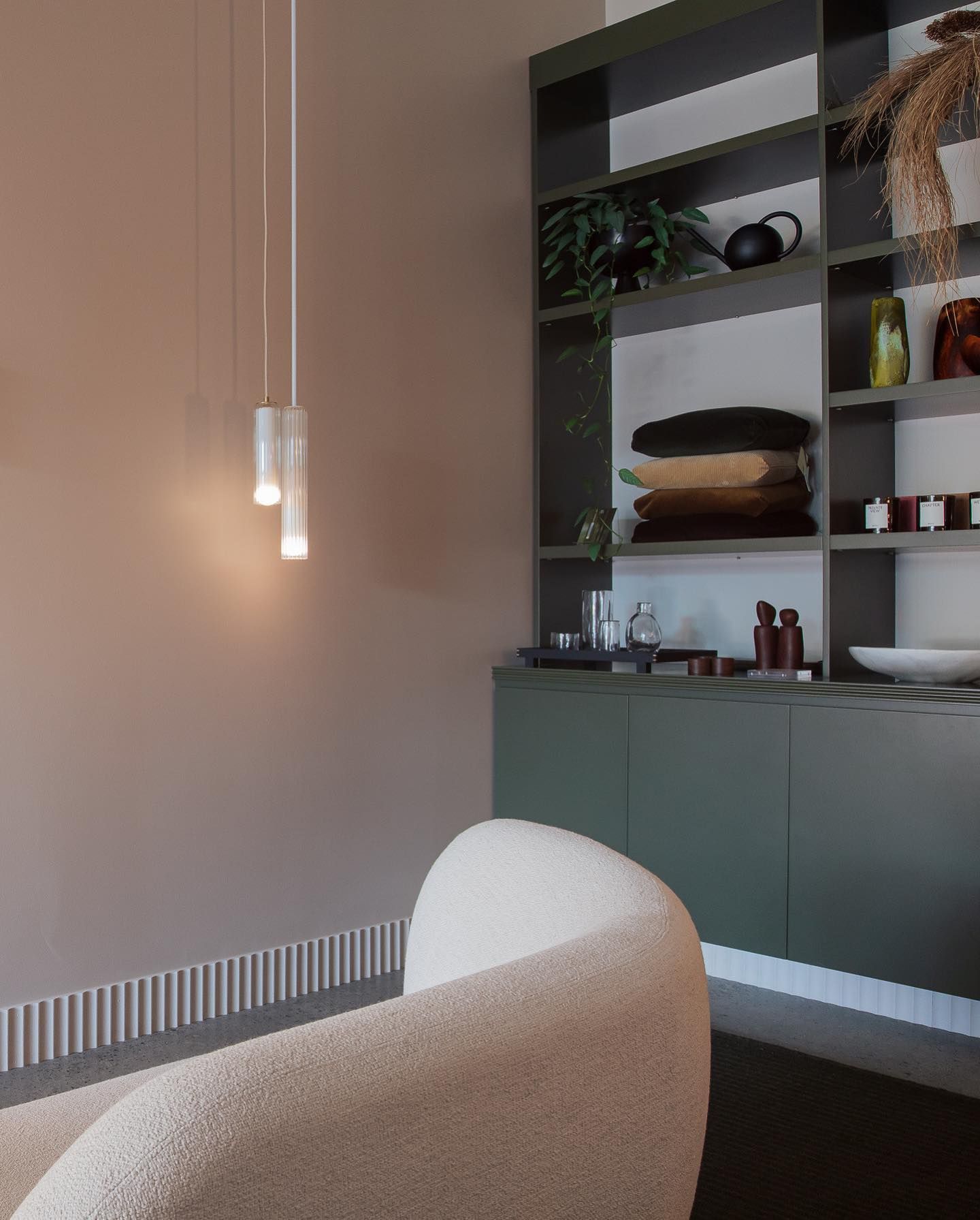 A Living Room With a Couch and a Bookshelf — Precision Kitchens & Cabinets in Ballina, NSW