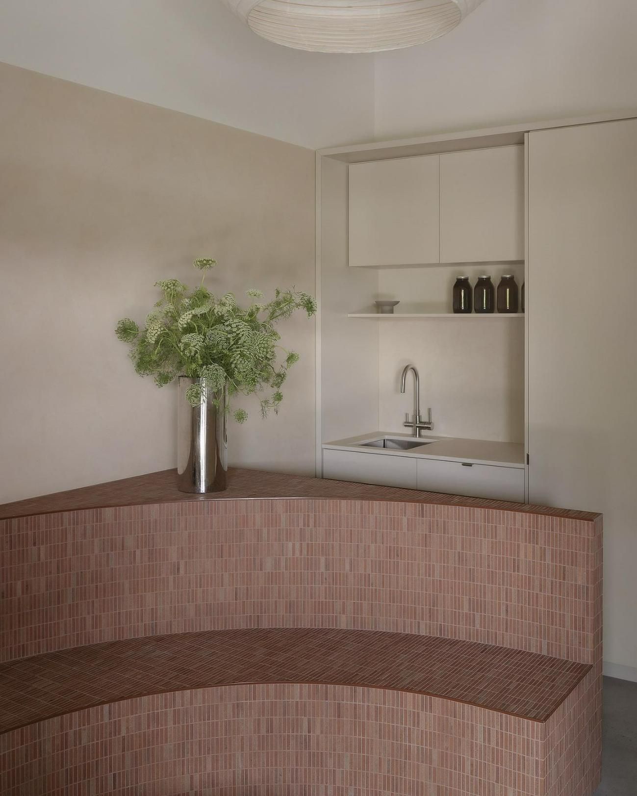 A Corner of a Room With a Wooden Bench and a Sink — Precision Kitchens & Cabinets in Ballina, NSW