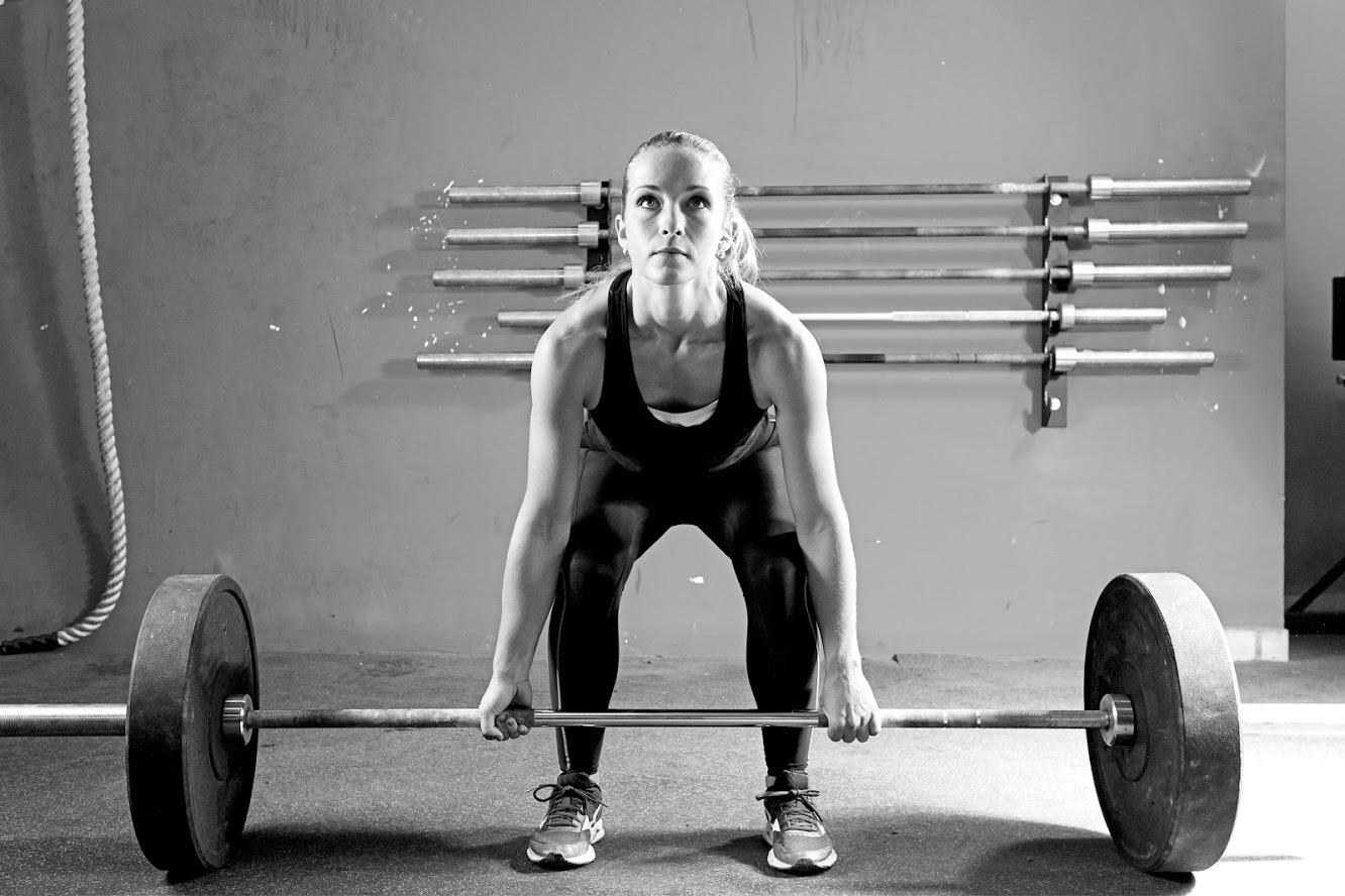 Residential Property Management — Young Woman on a Weightlifting Session in Scottsdale, AZ