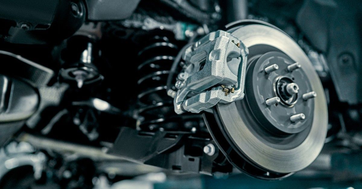 A car's system showing the brake calipers alongside the shock absorber.