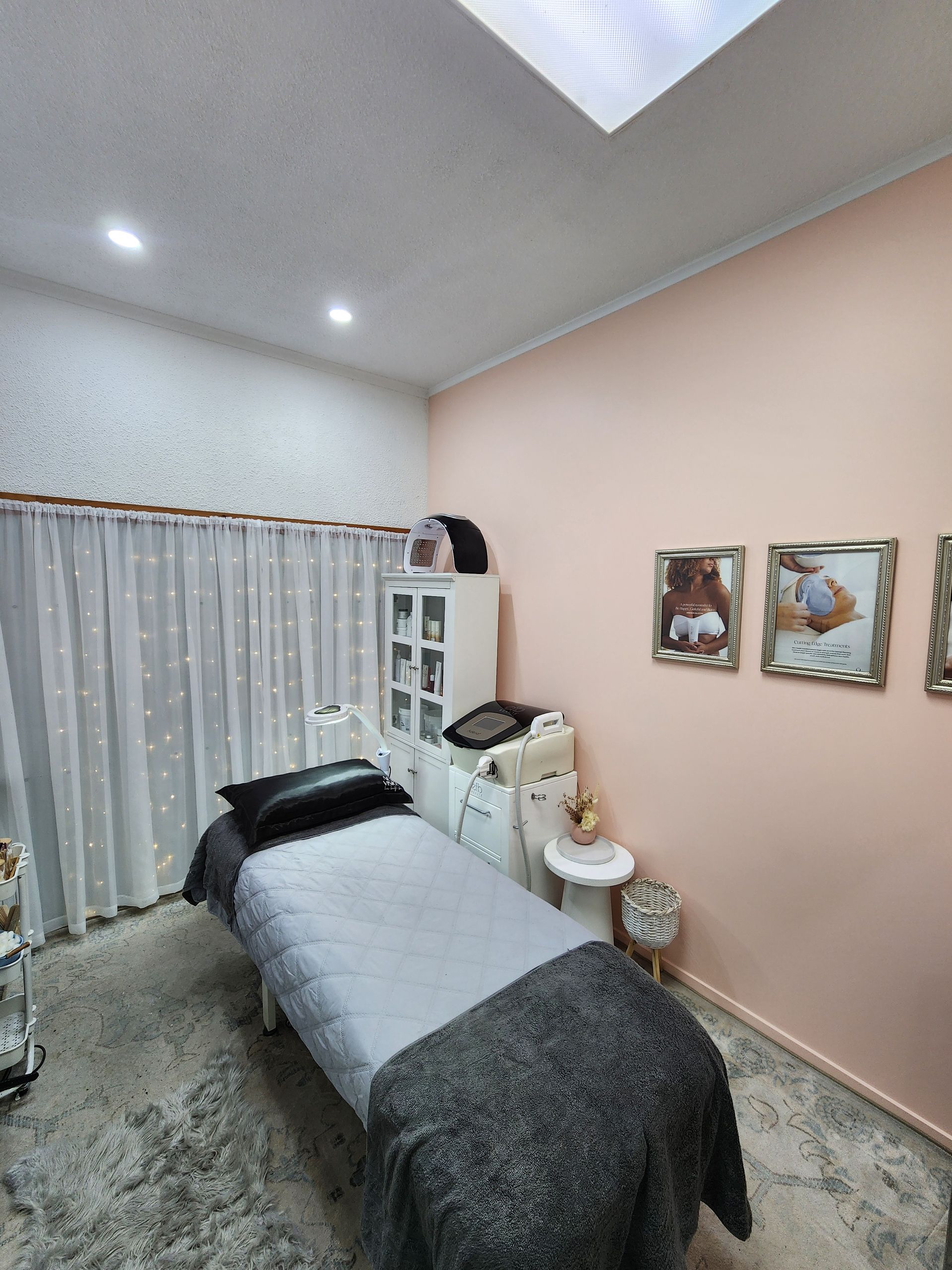 A woman is getting her eyelashes done in a beauty salon.