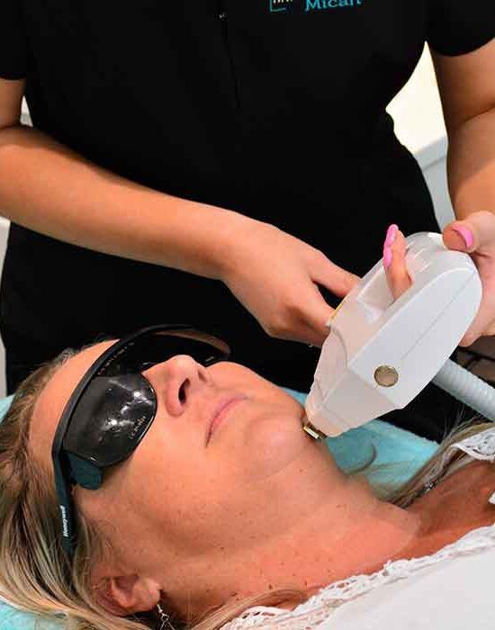 A close up of a woman 's eye with long eyelashes.