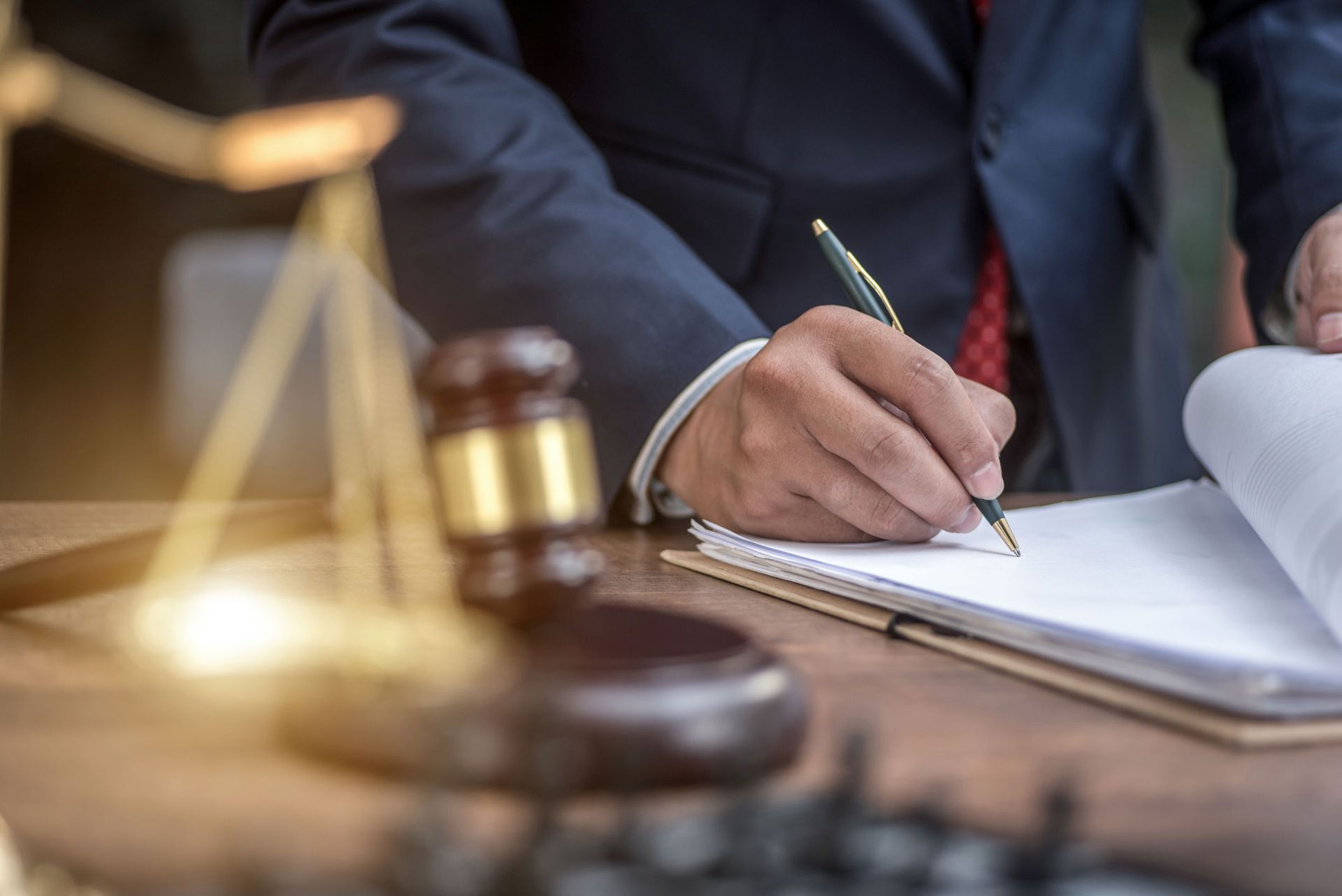 Lawyer Signing Documents — Newport Beach, CA — Paoli & Purdy, PC