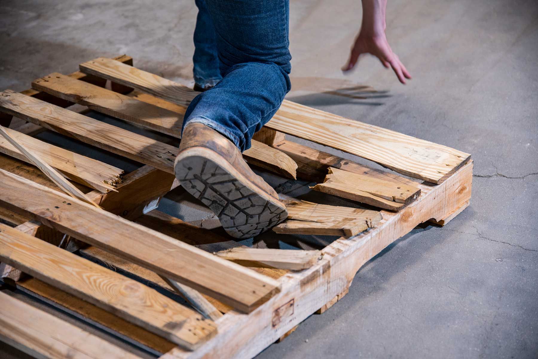 Person Stepping on a Broken Pallet — Newport Beach, CA — Paoli & Purdy, PC
