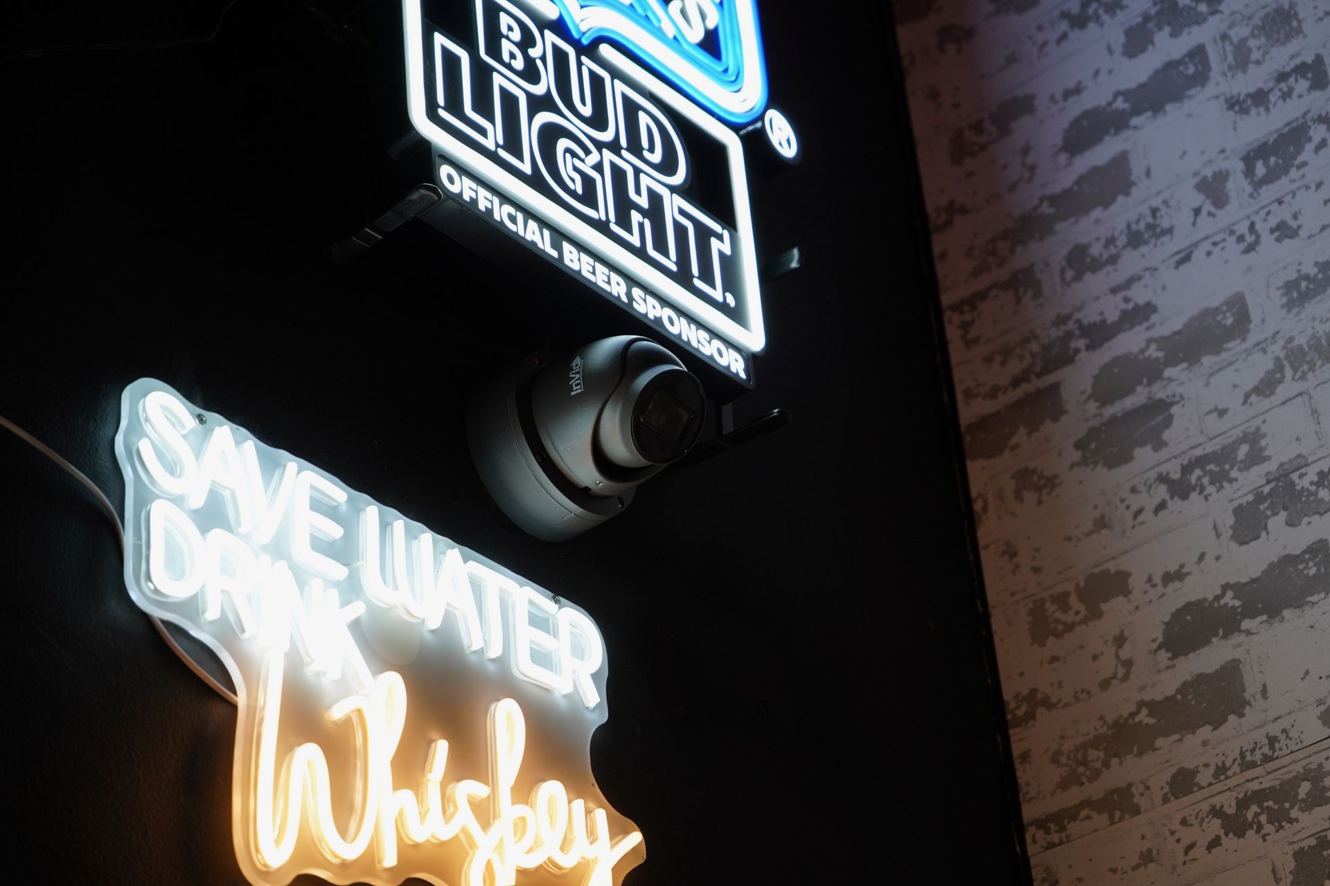 A bud light and save water whiskey neon sign