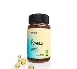 Bottle of Solex AD Pearls probiotics with scattered yellow capsules.