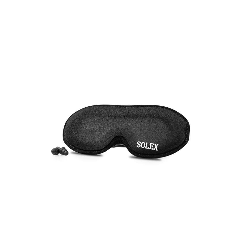 Black sleep mask with "SOLEX" logo and two earplugs on white background.