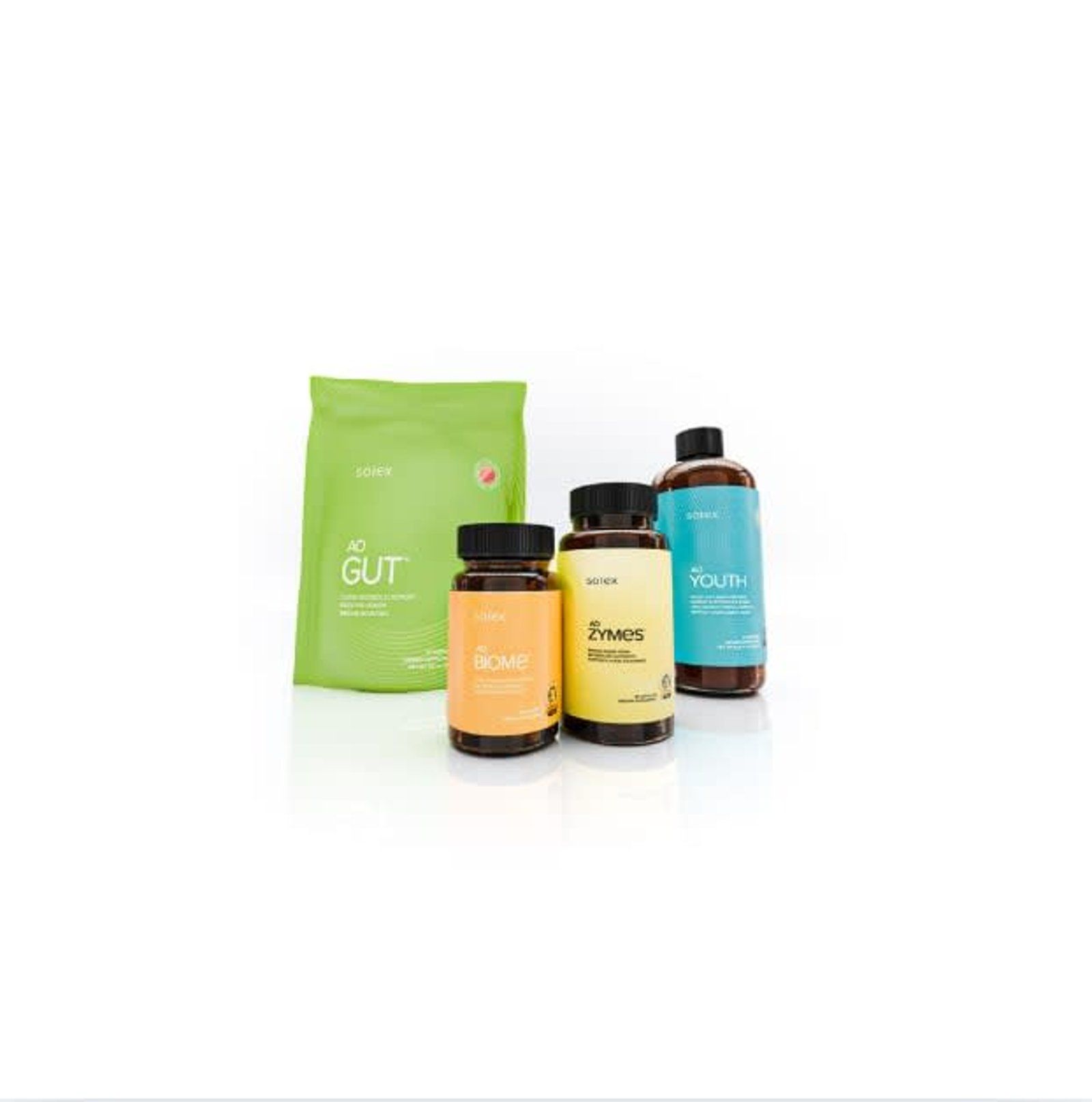 Four health supplements: powder packet, two pill bottles, and a bottle with liquid.