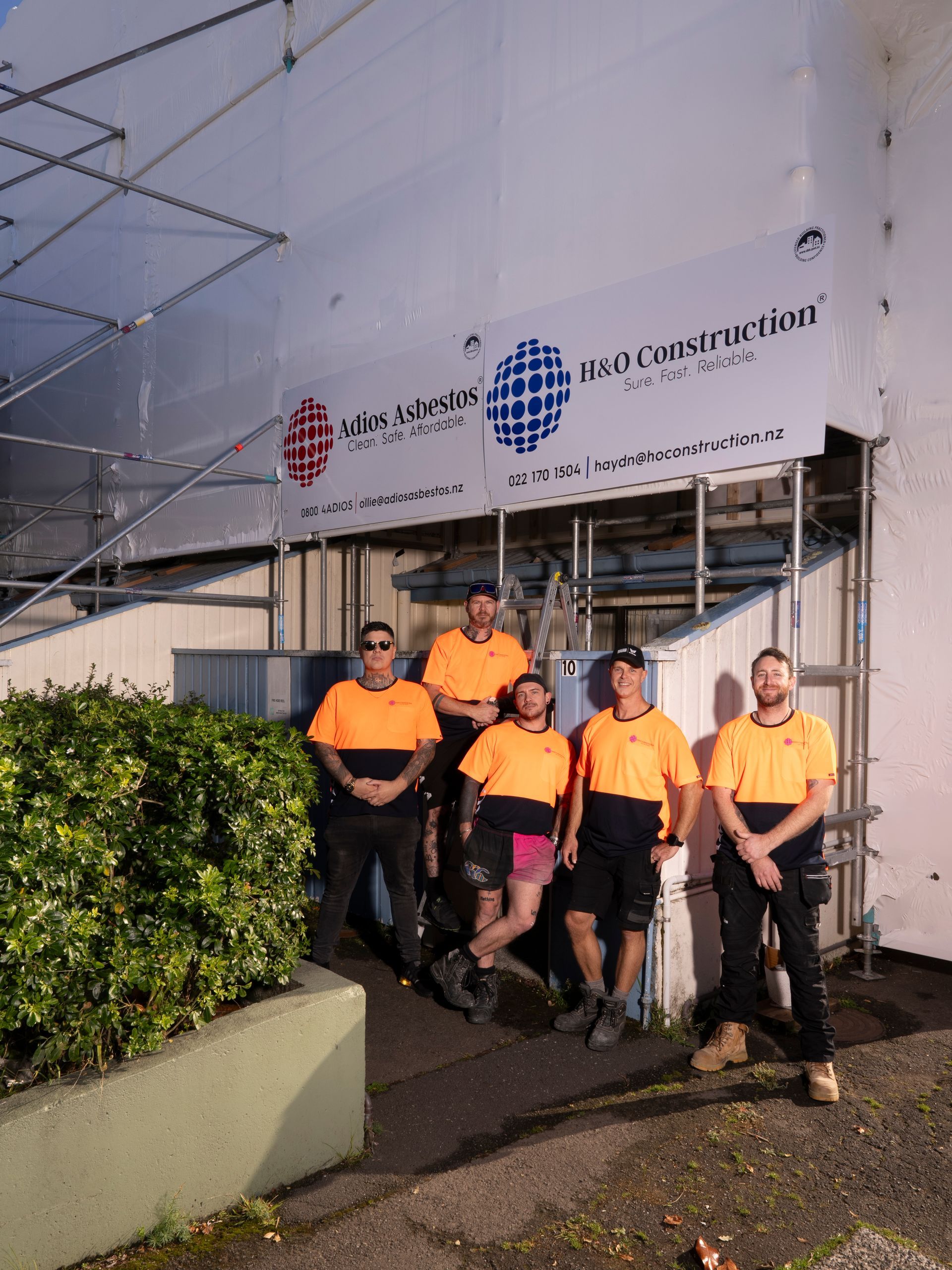 Construction Workers in Front of A Building — Wellington, NZ — H & O Construction