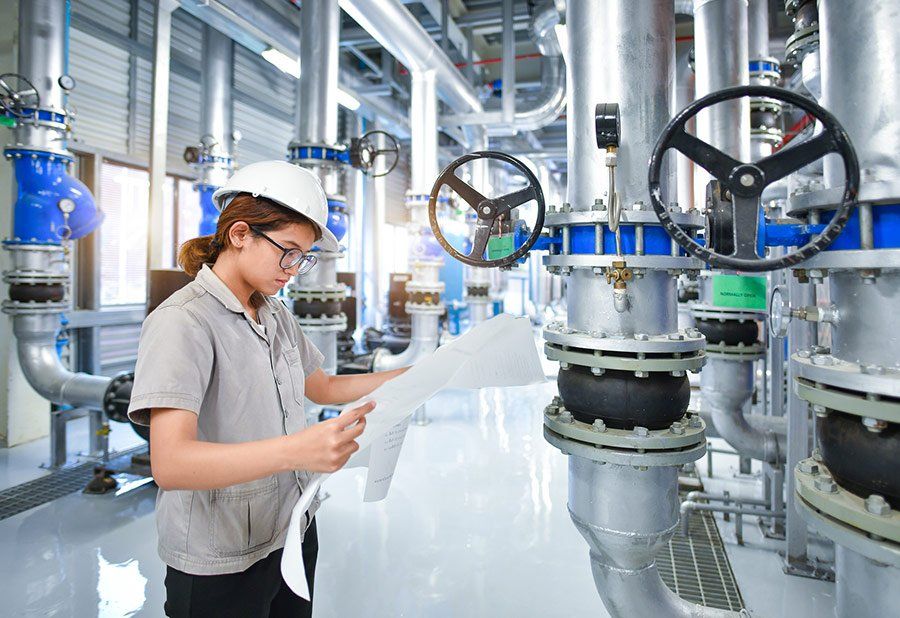 Woman Monitoring Water Pipes — Clinton, MS — Cornerstone Engineering LLC