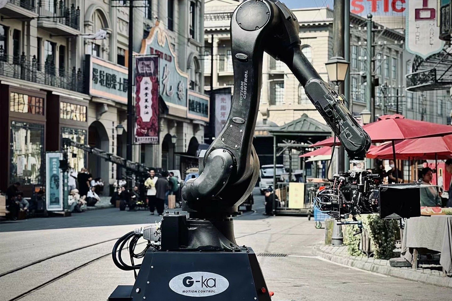 G-ka motion control is standing in the middle of a city street.