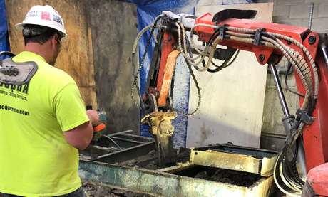 concrete demolition robot at work crushing concrete