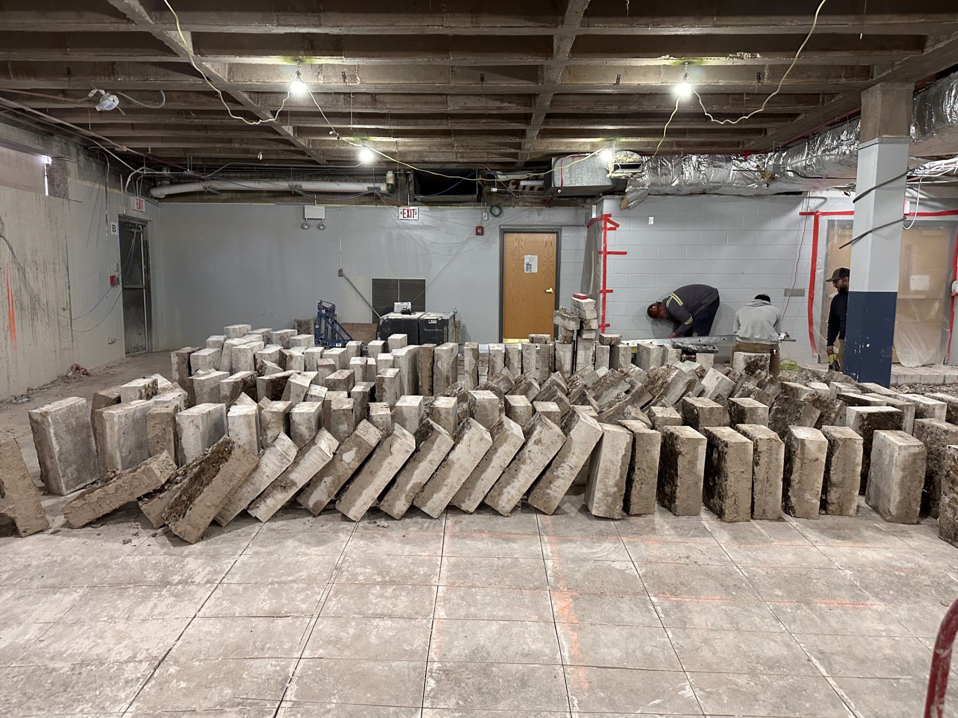 A bunch of concrete blocks are stacked on top of each other in a room.