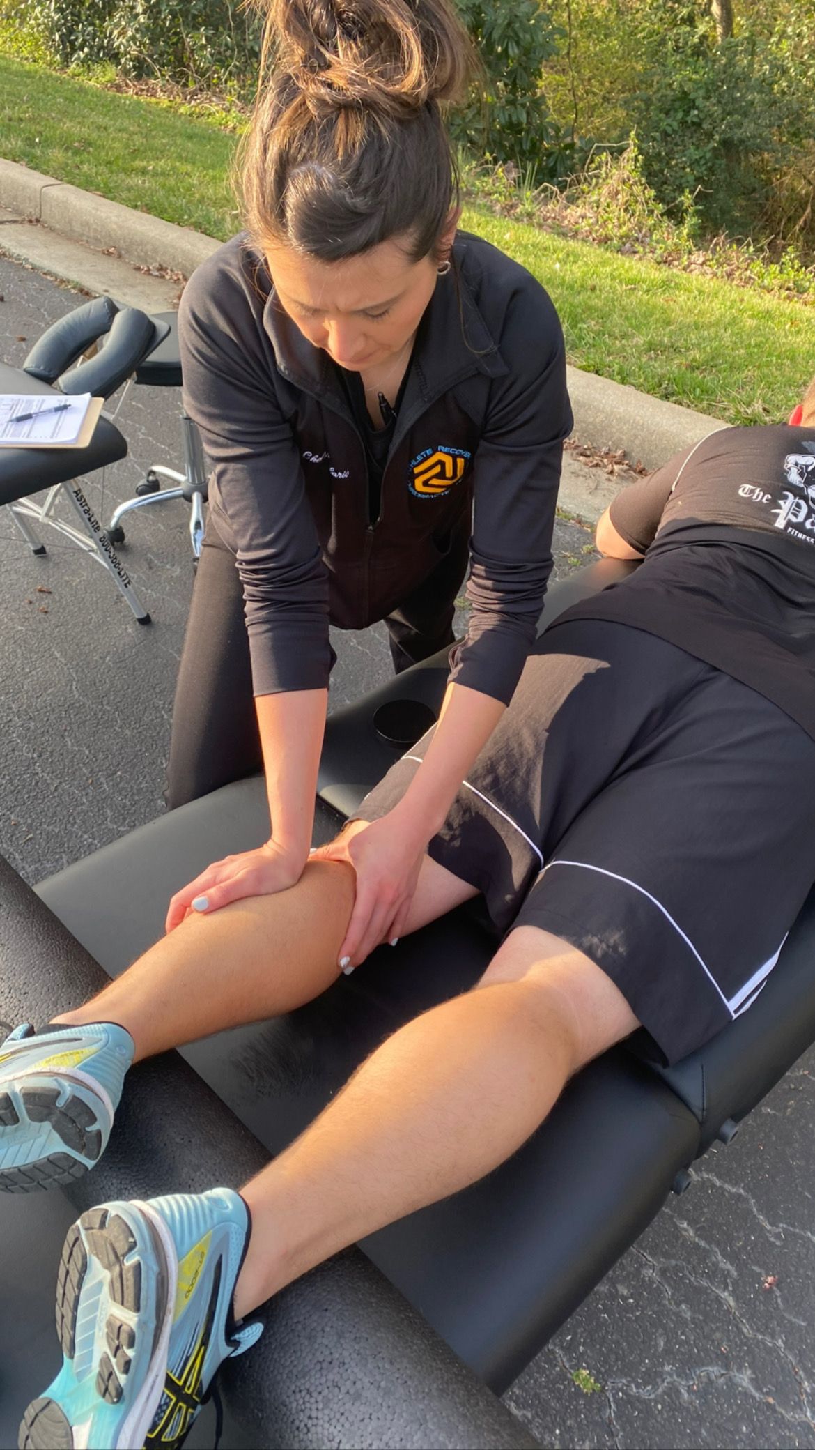 A man is laying on a table getting a chiropractic treatment.