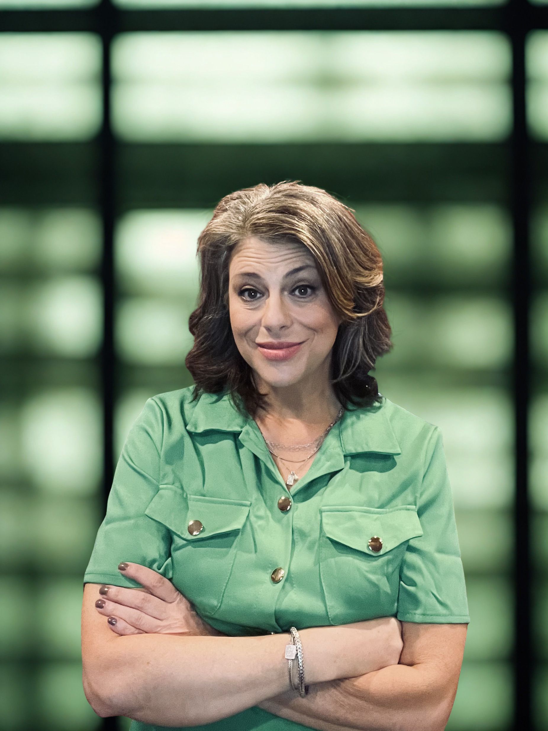 Erin Bristol Woods headshot in green 