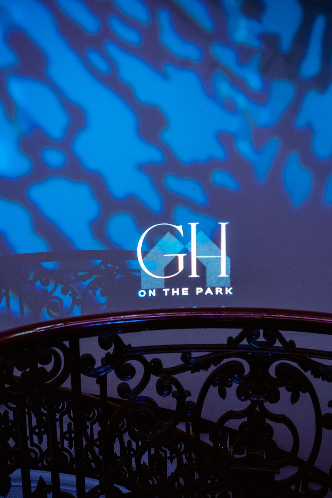 A sign that says gh on the park is projected on a wall