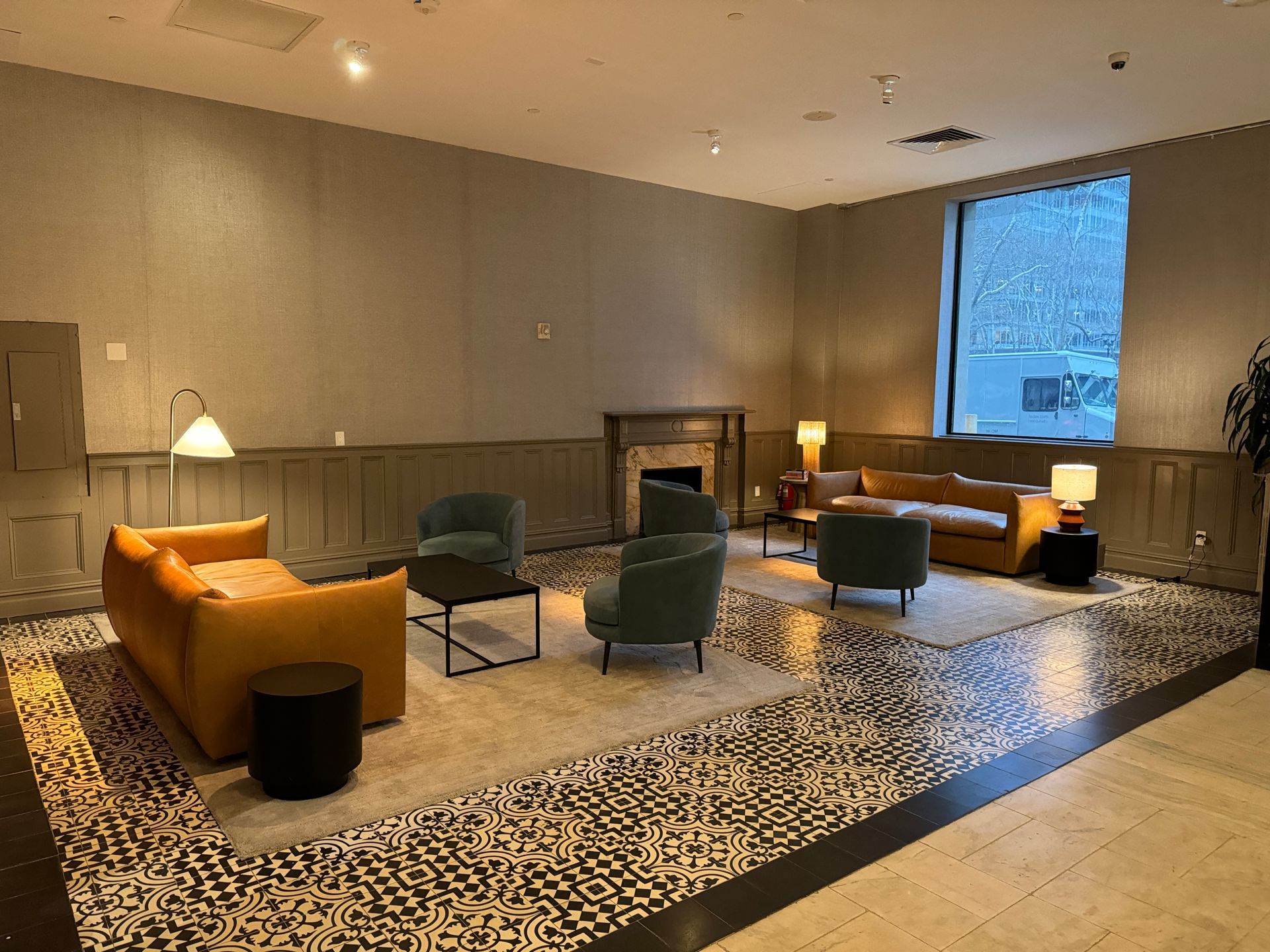 A living room filled with furniture and a fireplace.
