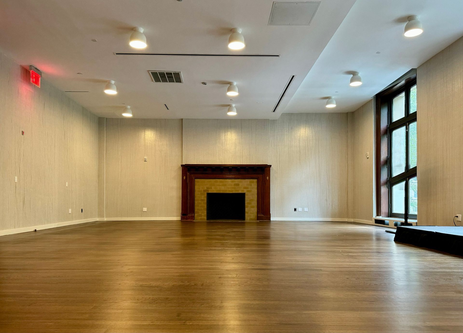 There is a fireplace in the middle of the room.