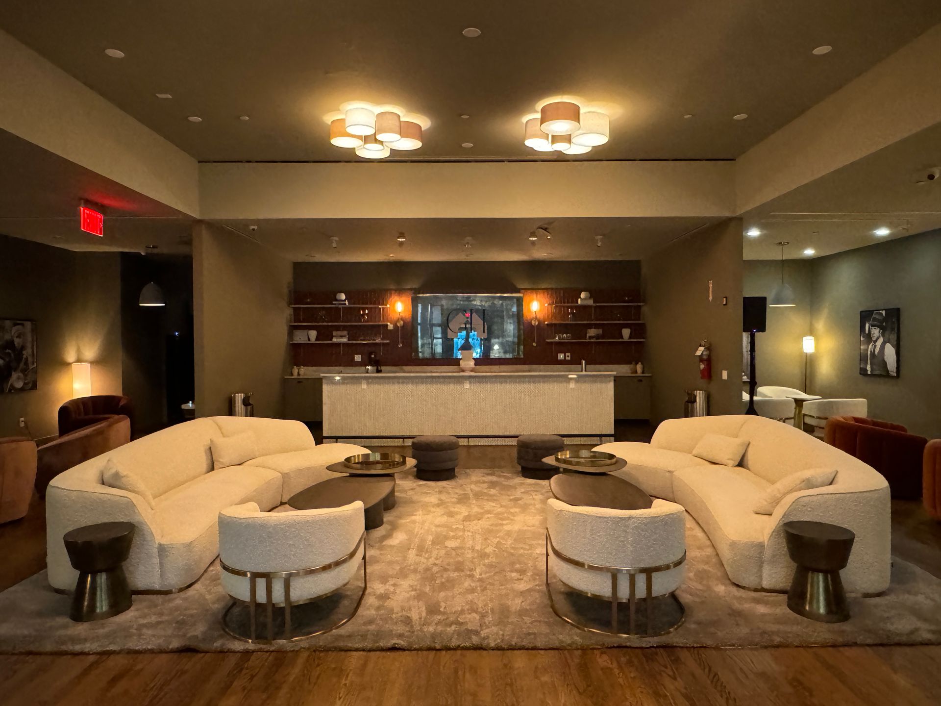 A living room filled with furniture and a bar.