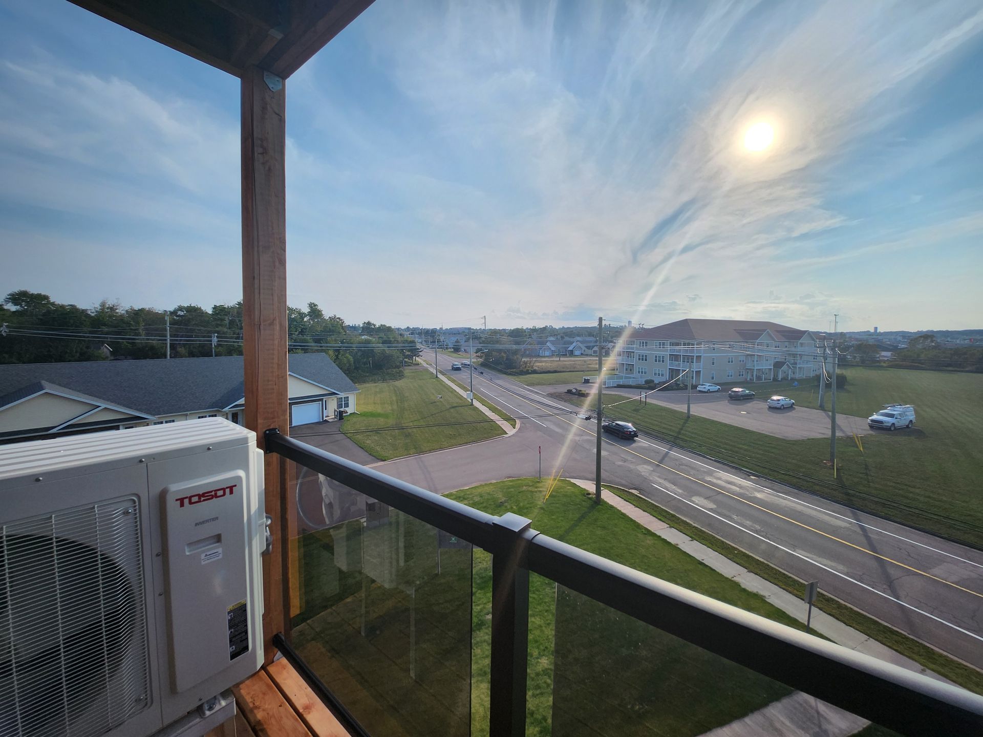 Blue sky clear view from an apartment balcony in The Simmons.