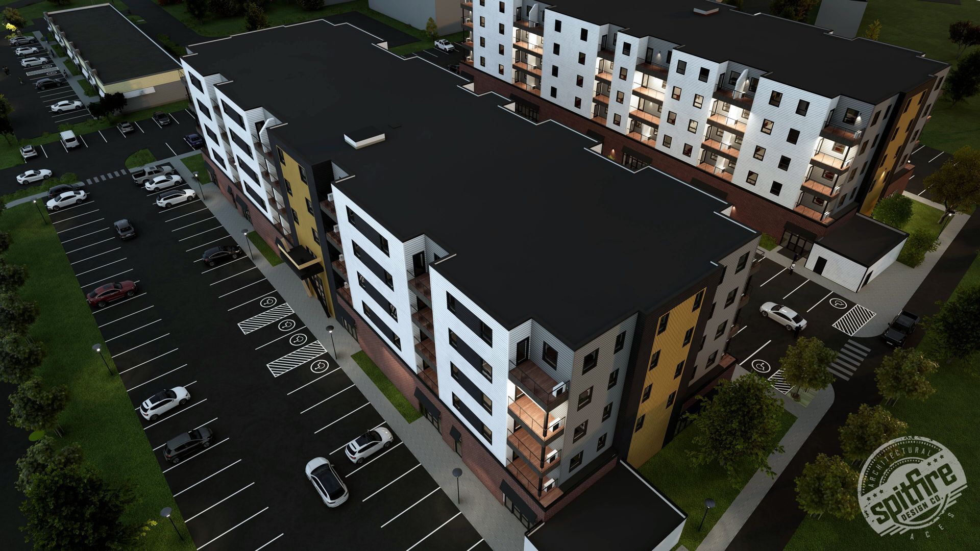 LOT 48 residential housing development in Stratford, PEI. Grey, yellow, and white facade with windows and balconies, parking lot.