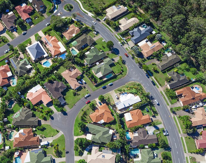 An Aerial View of a Residential Area With Lots of Houses — Coppo's Electrical in Helensvale, QLD