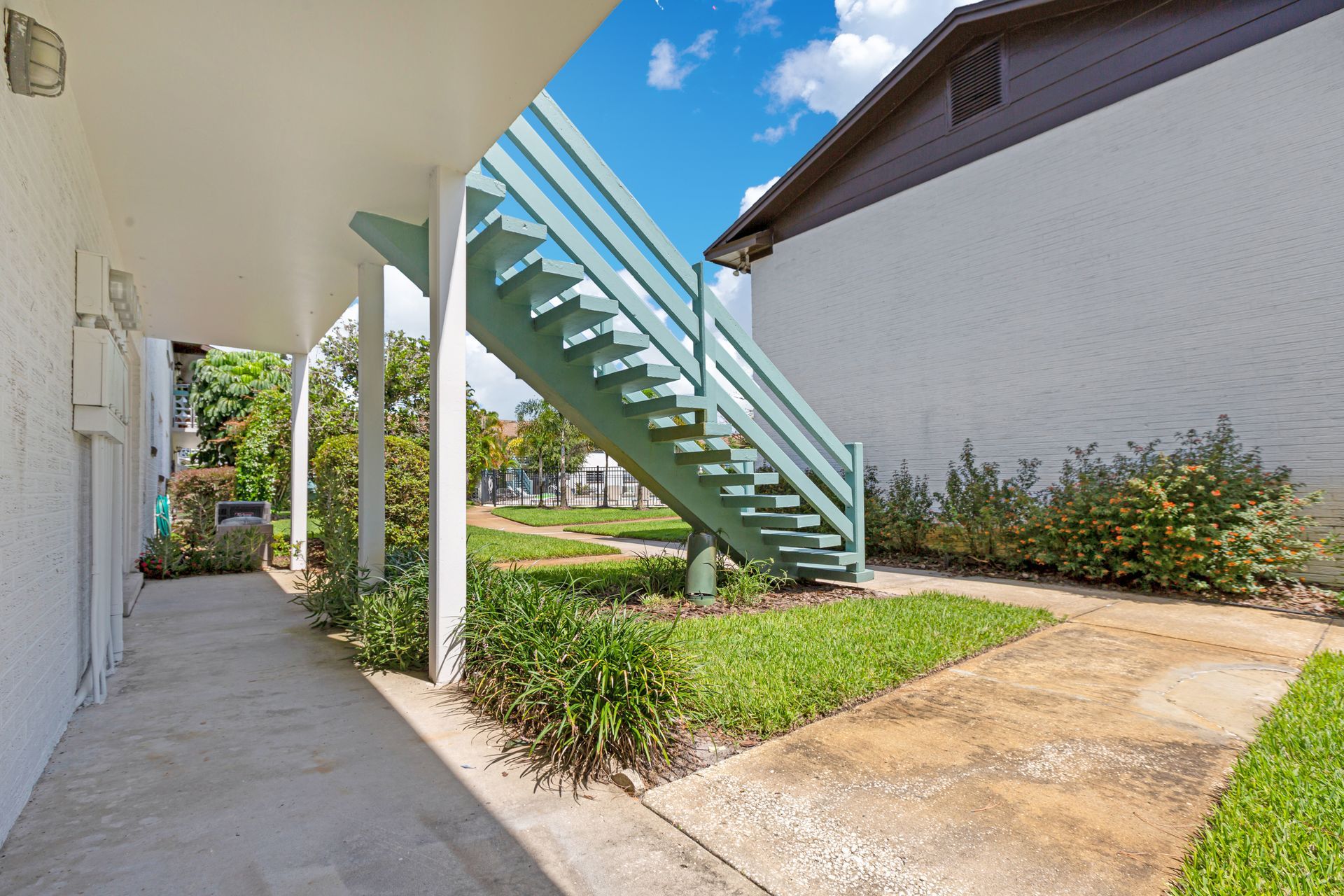 A building with stairs leading up to the second floor.