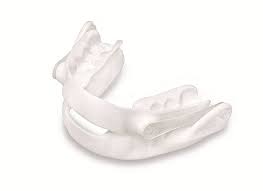 White oral appliance used for treating sleeping disorders.