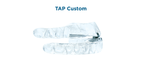 Side-view of clear oral appliance used for sleep apnea therapy.