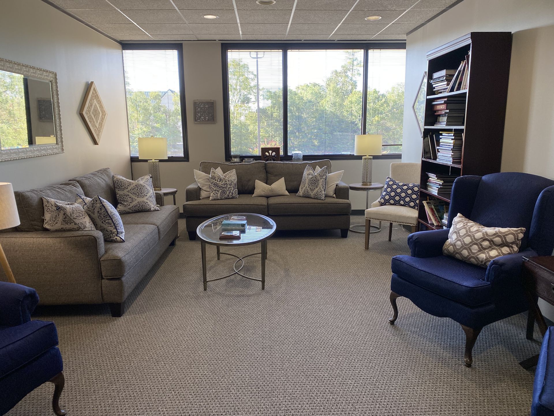 Alternate angle of patient lobby, showing off comfy chairs and couches in the waiting area.