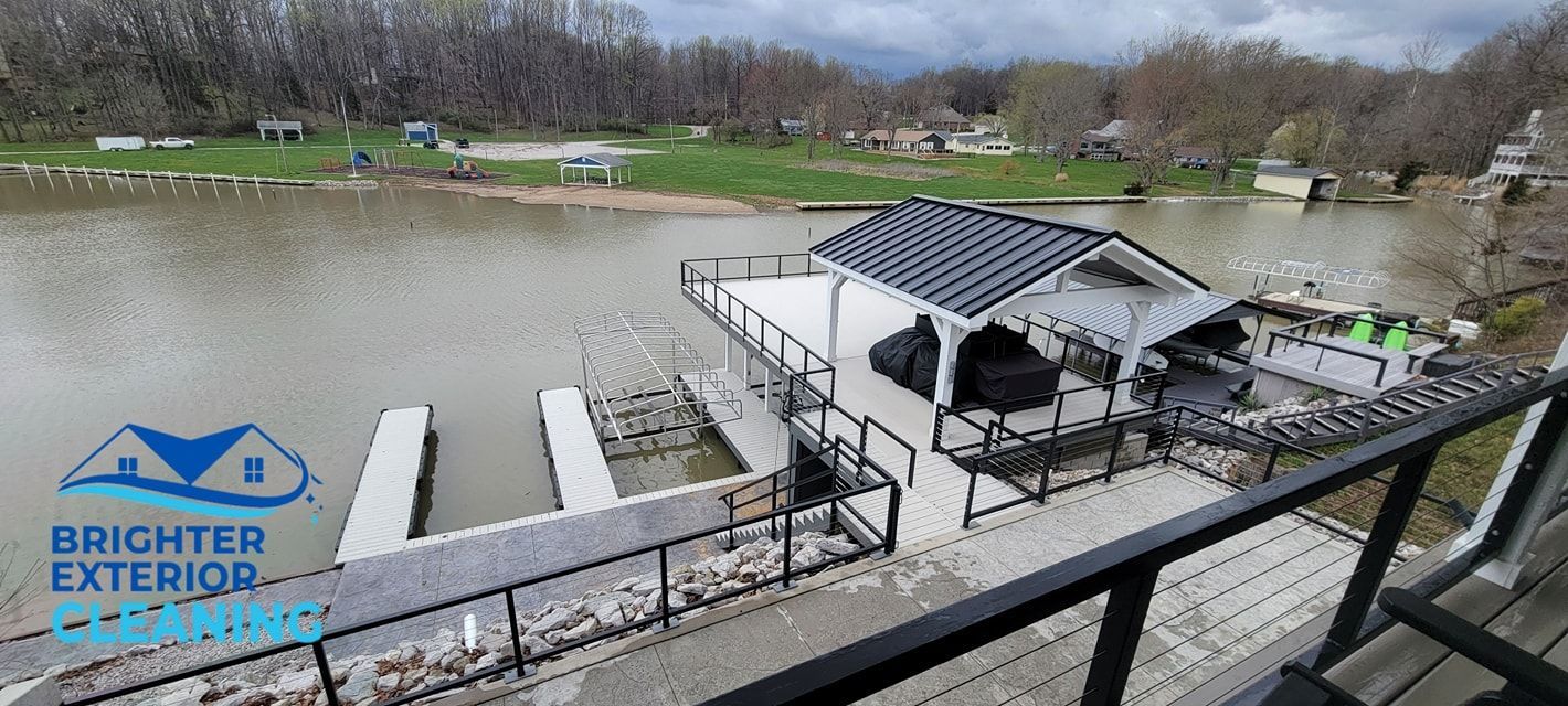 A view of a dock from a balcony overlooking a body of water.