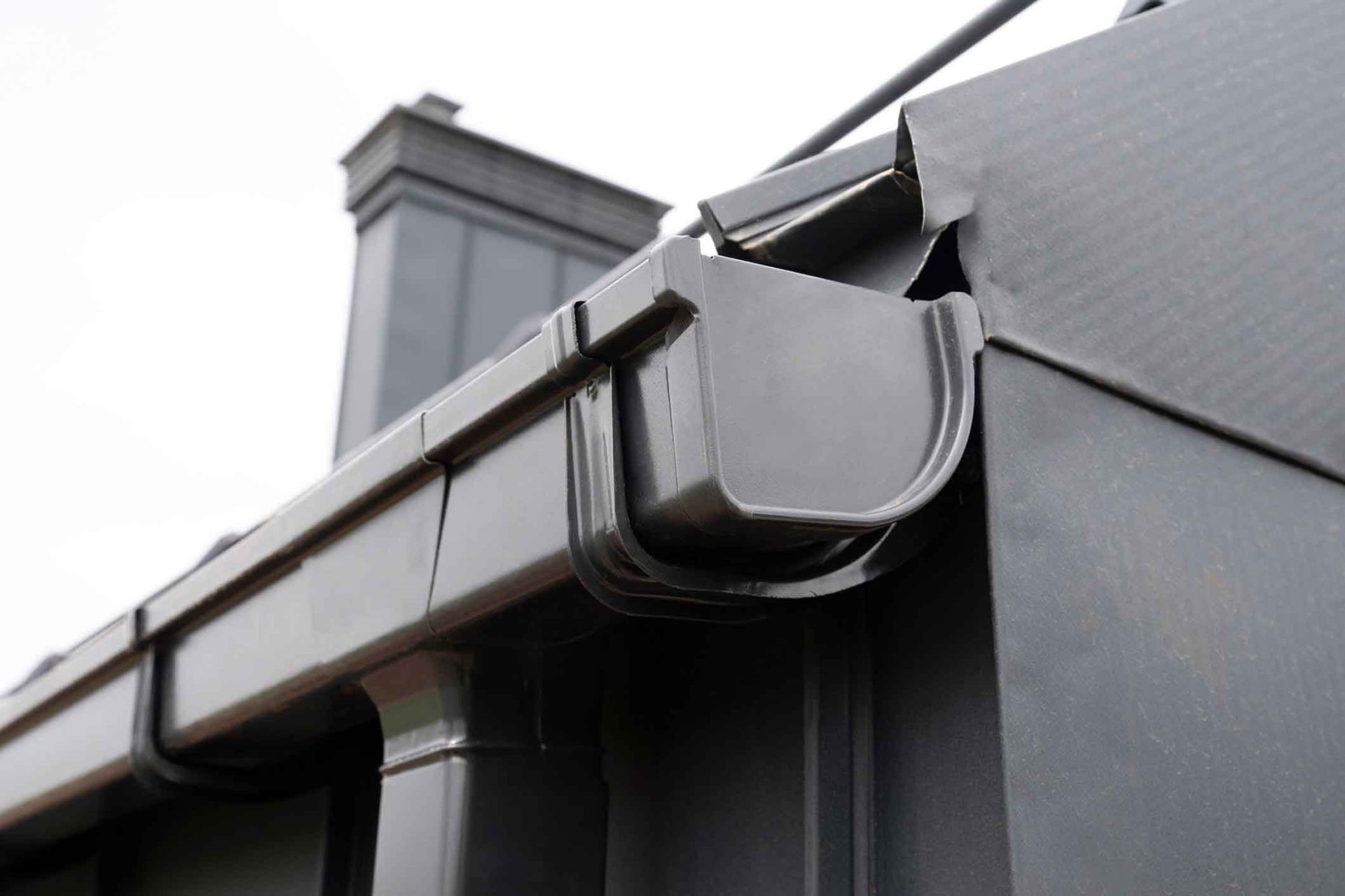 Precision gutter guard installation showing proper placement of micro-mesh protection system
