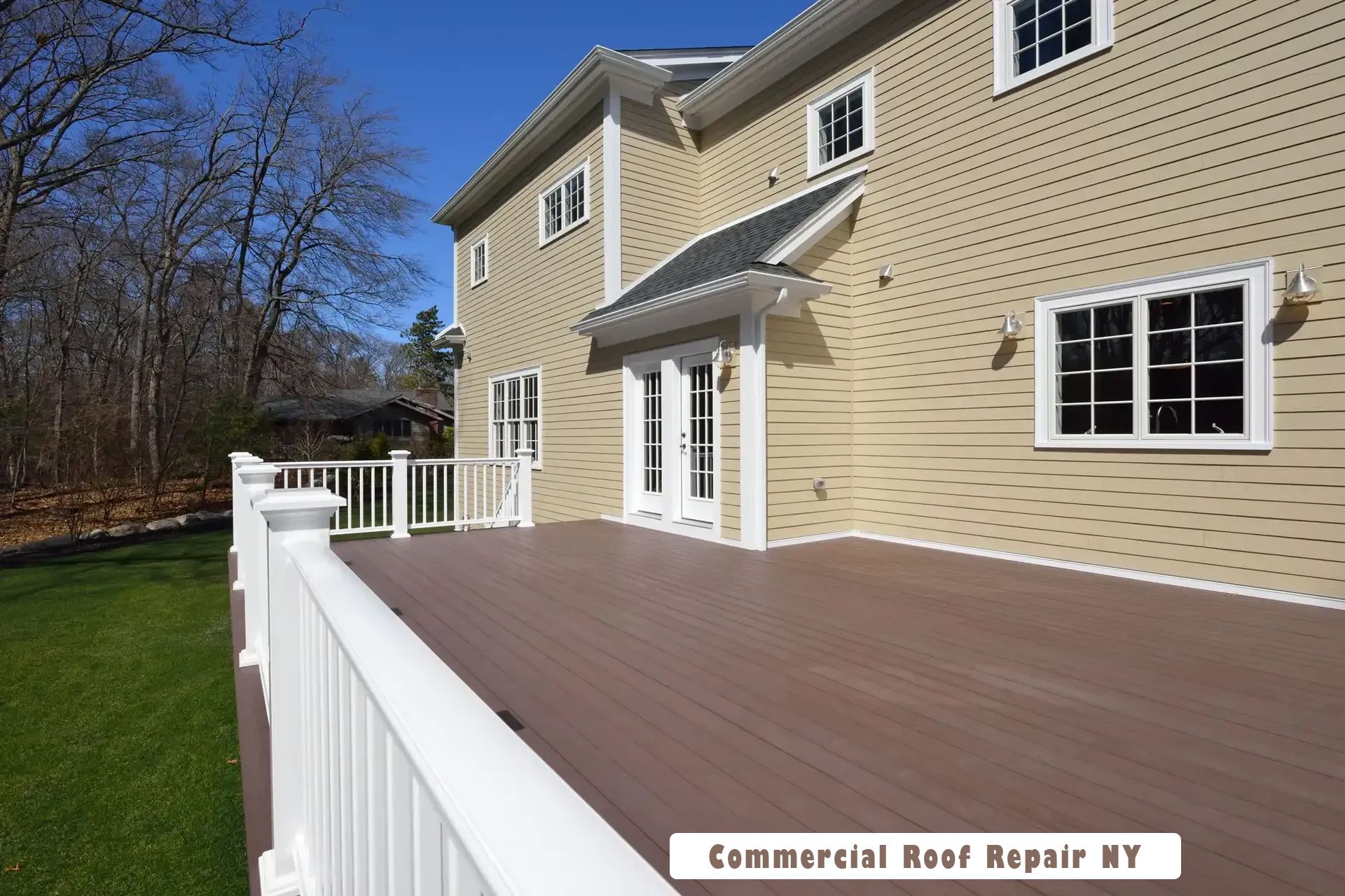 A large house with a large deck in front of it