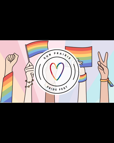 A group of people are holding up rainbow flags and making peace signs.